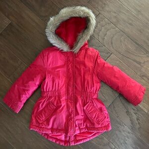 Adorable little girl’s red puffer jacket with fur trimmed hood.  Size 4